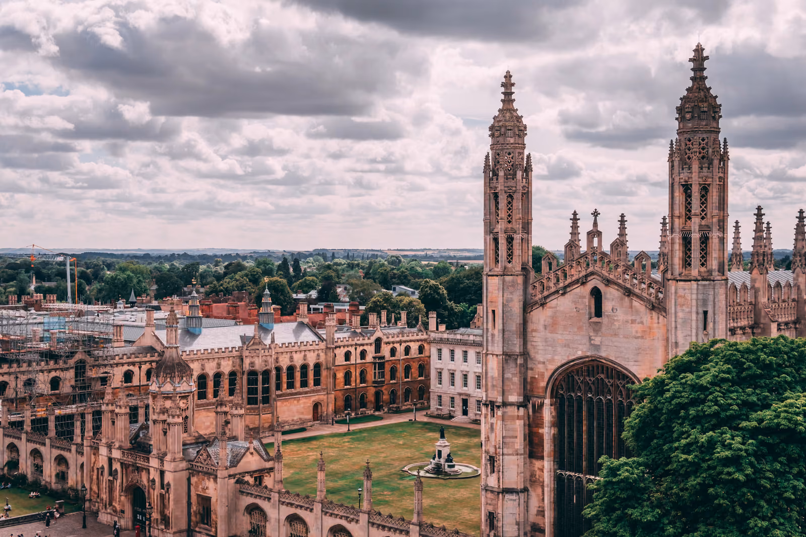 A rooftop view over King's College, Cambridge, showing the chapel's pinnacled Gothic towers and college lawns.