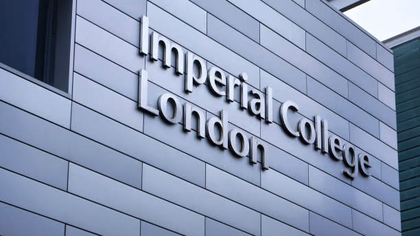 Metal lettering reading Imperial College London mounted on the grey panelled facade of a campus building