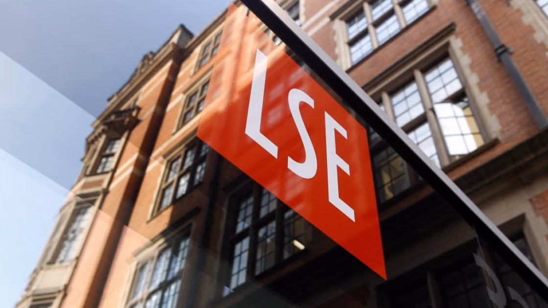 The red LSE sign mounted on the side of a red-brick building at the London School of Economics