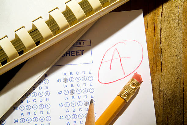 A multiple-choice answer sheet marked with a red circled letter A, with a yellow pencil resting on it.